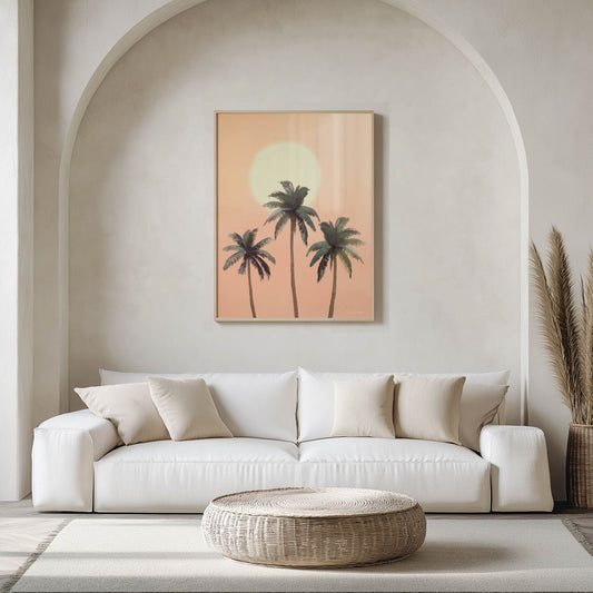 Modern living room with a white sofa, woven coffee table, and wall art of palm trees.