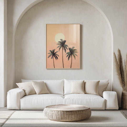 Modern living room with a white sofa, woven coffee table, and wall art of palm trees.