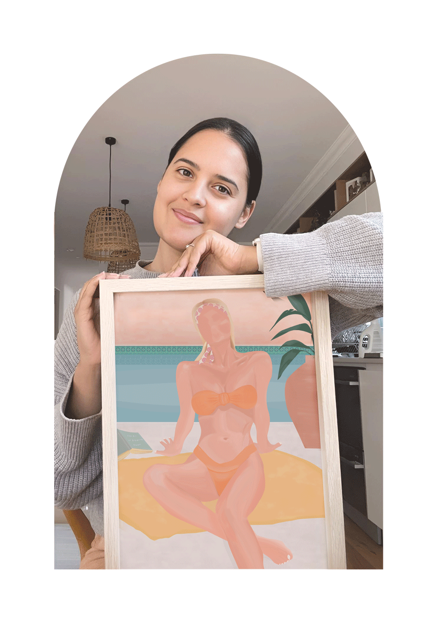 Artist holding a framed artwork of a woman in a bikini.