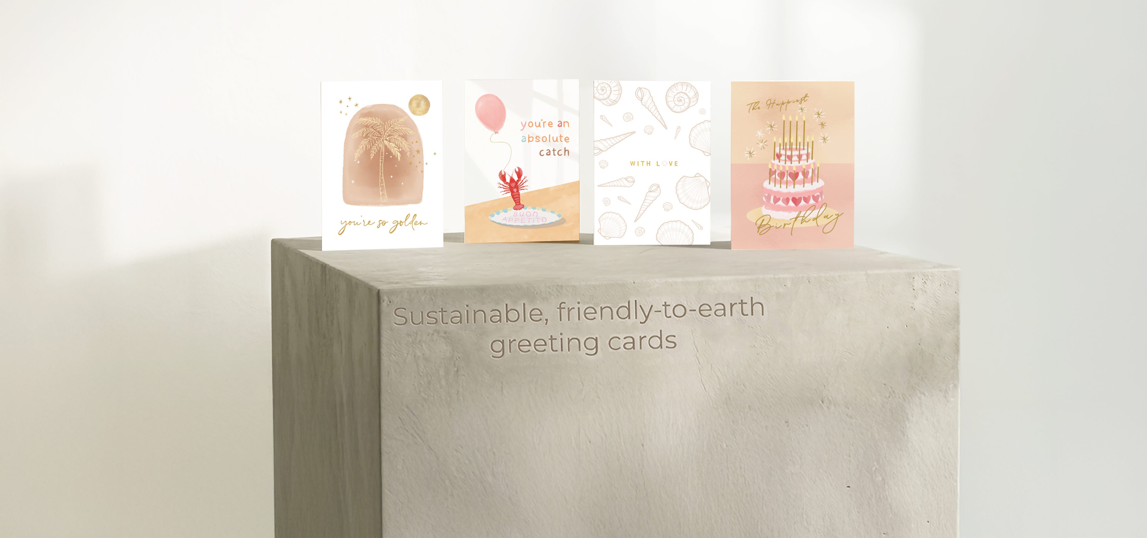 Collection of greeting cards on a white surface with a neutral background