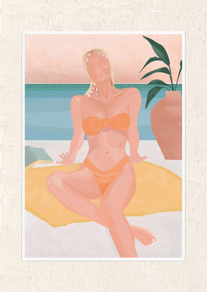 Woman in an orange bikini sitting on a towel with a plant in the background