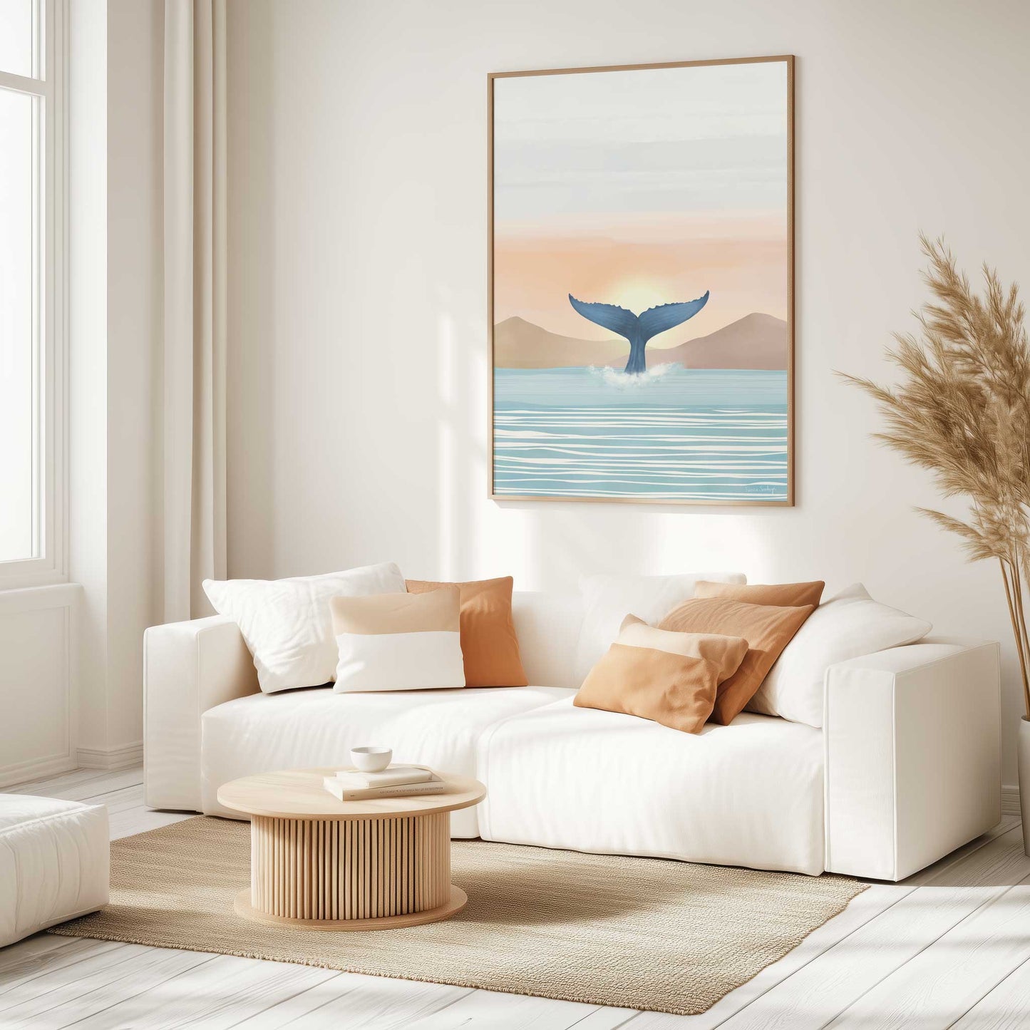 Modern living room with a white sofa, wooden coffee table, and whale art print on the wall.