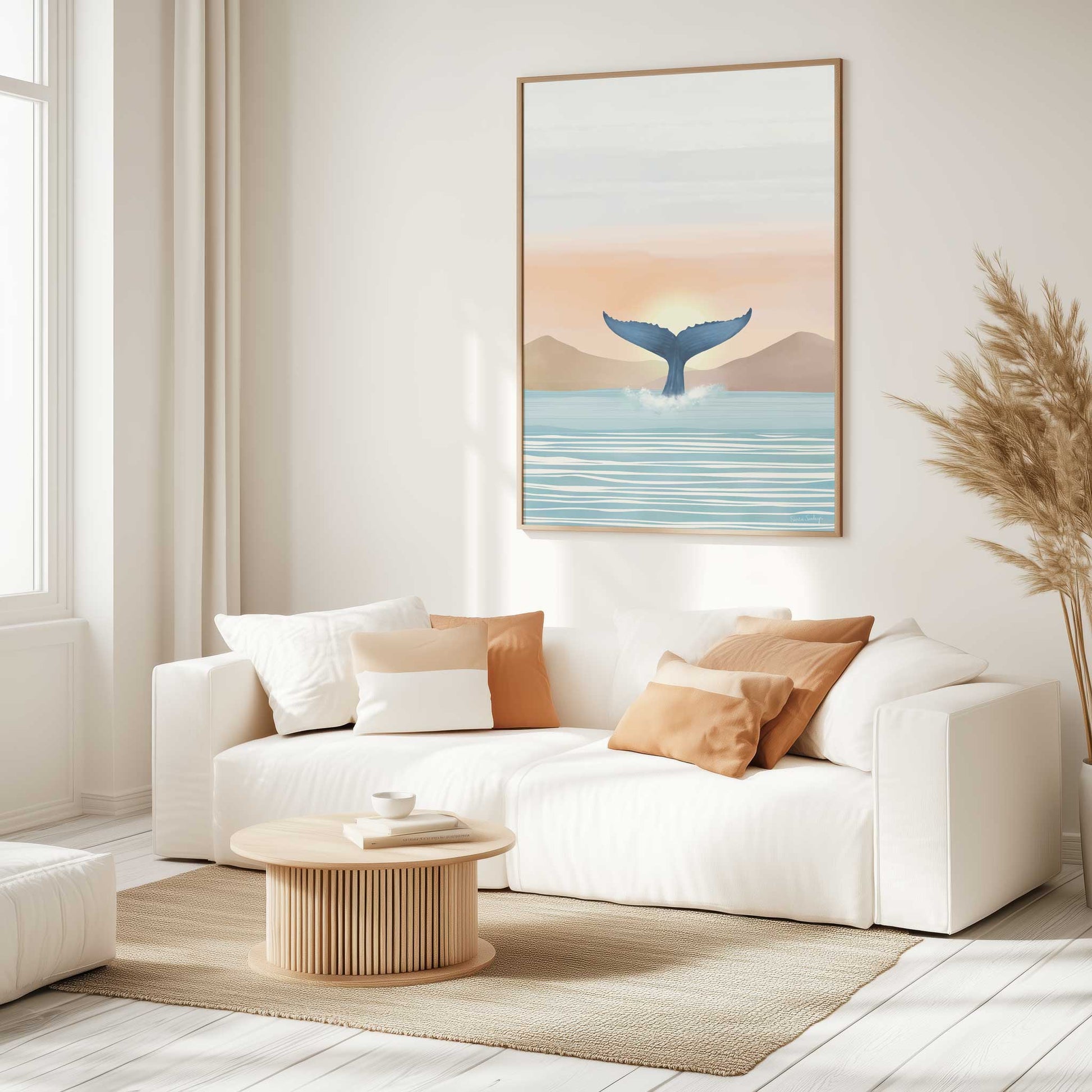 Modern living room with a white sofa, wooden coffee table, and whale art print on the wall.